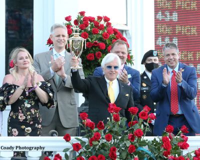 Trainer Bob Baffert hoisting the Kentucky Derby trophy for a record seventh time after Medina Spirit's victory