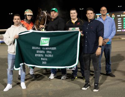 All smiles . . . connections following Father Bob's Group 1 win in the TAB Regional Championships Riverina Final at Wagga tonight.