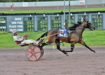 Crazy Cute poses for win circle photo